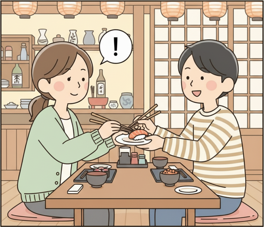 One person placing food on a small plate and handing it politely to another person with both hands