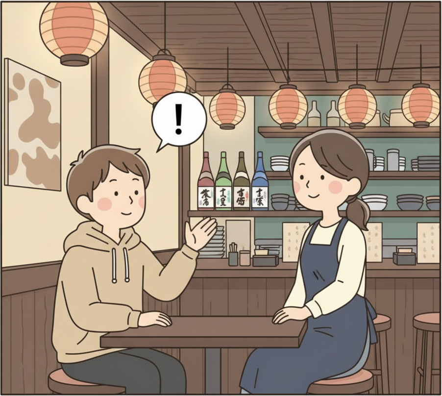 居酒屋のテーブルで片手を落ち着いて上げてスタッフを呼んでいる人